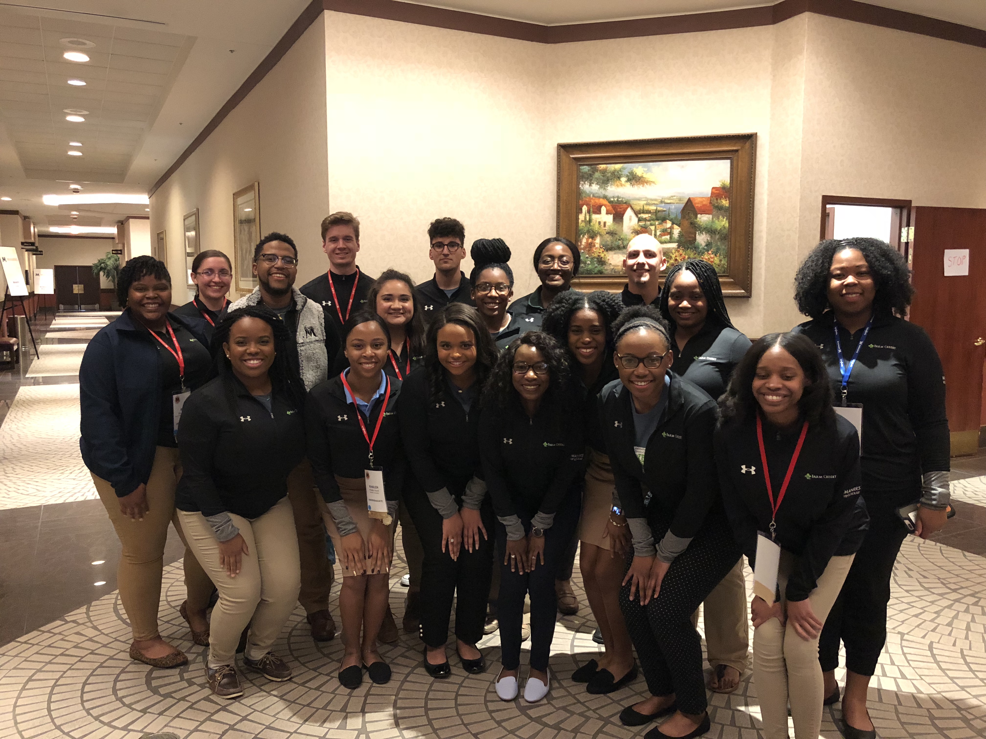 Celize Christy stands with the 2018 class of Farm Credit/MANRRS VIP Scholars smiling during the MANRRS conference.