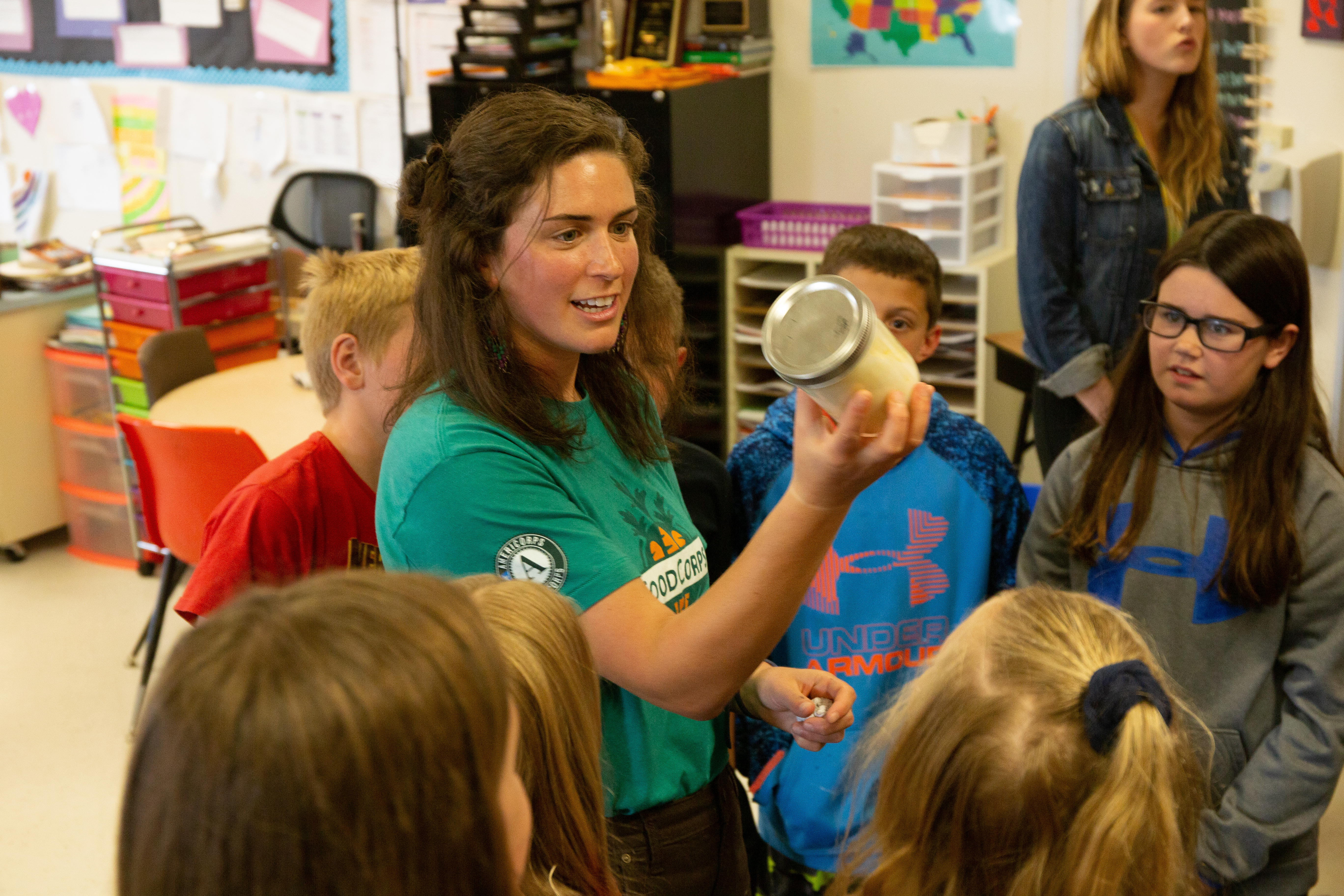 A FoodCorps service member teaches young kids in the classroom.