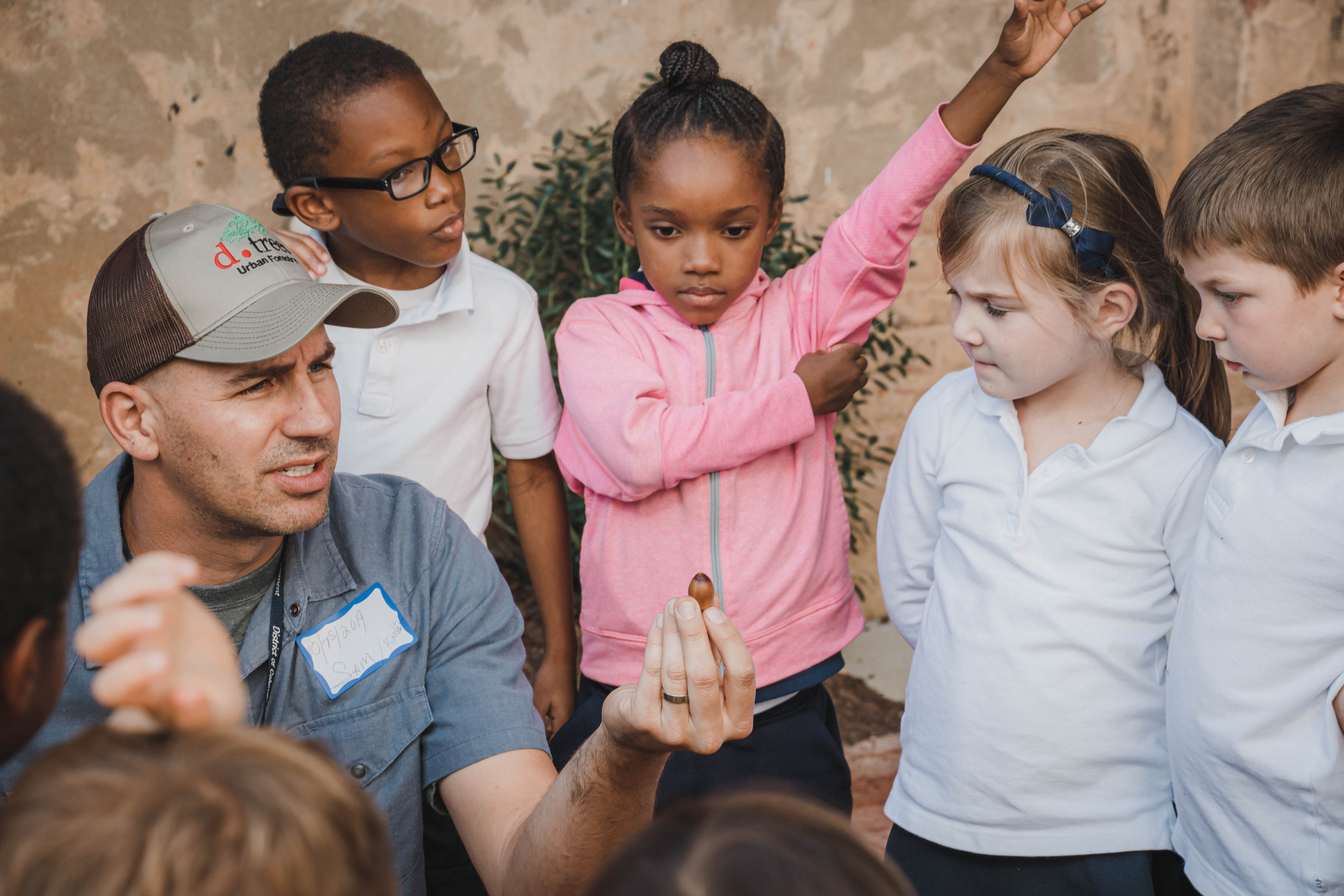 Sam Ullrey recaps the farm to school project with kindergartners of Maurey Elementary 