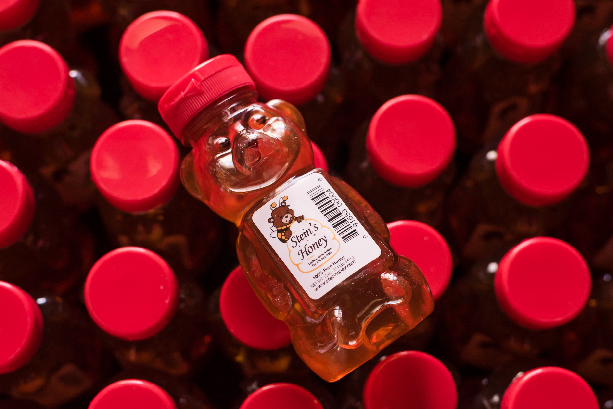 Steins Honey in a bar jar with a red lid on top