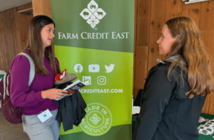 Dairy Challenge student and Farm Credit East representative speak at career fair